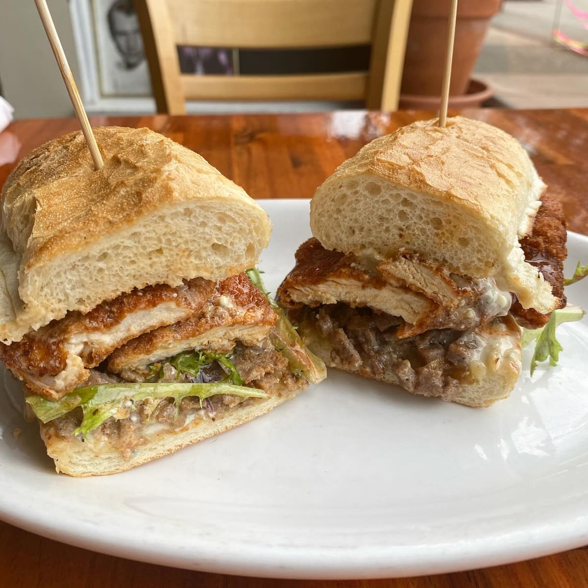 The Buffalo Stinger: chicken fingers and steak on a roll, cut in half