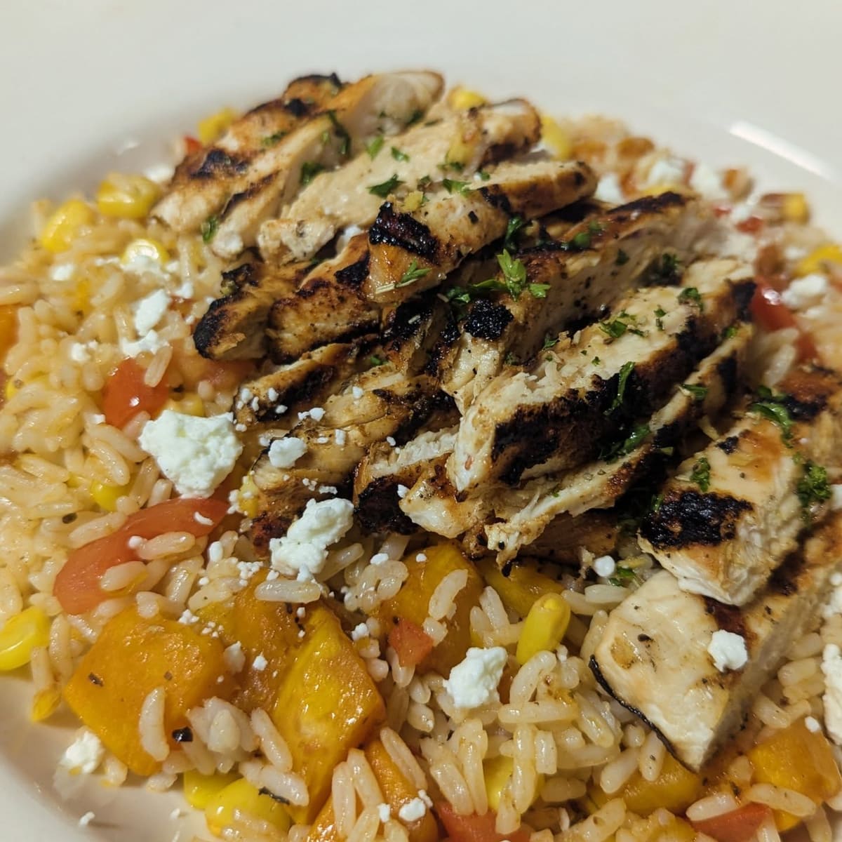 Rum butternut squash with grilled chicken over rice and feta